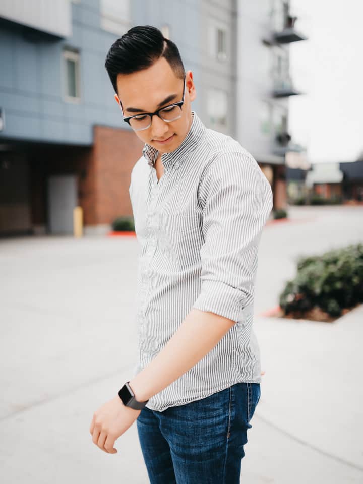 Man looking down at his arm.