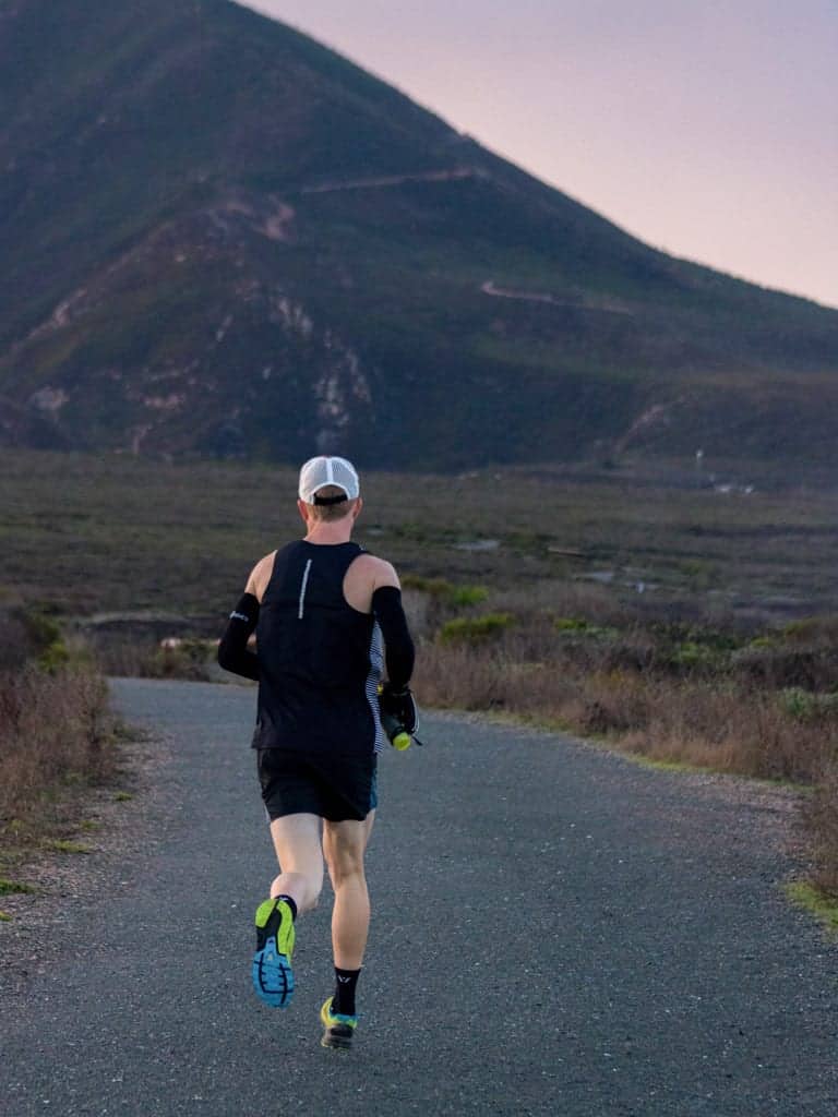 Person running on an outdoor trail.