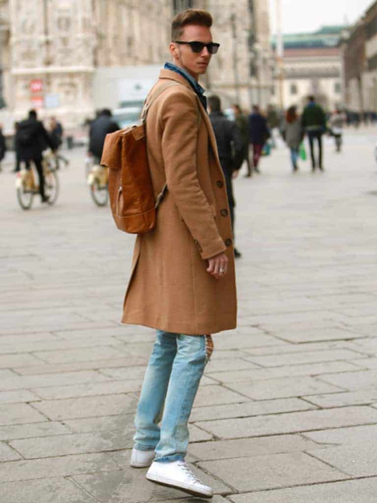 Person wearing a backpack turning around.