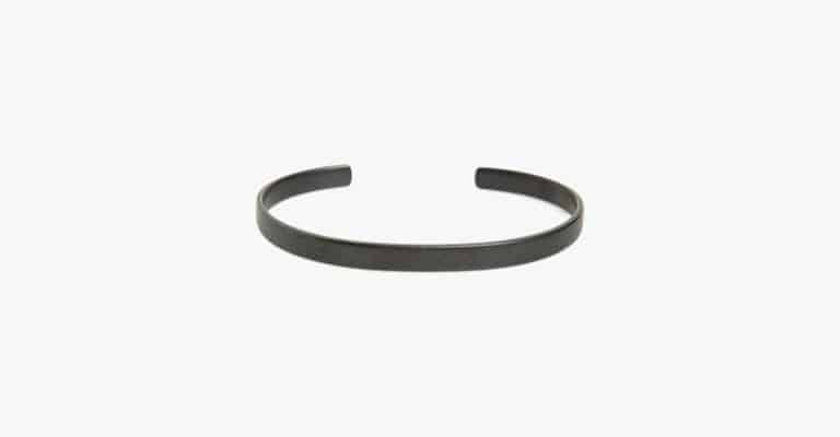 Dark grey metal cuff bracelet.