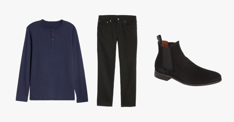 Collection of a navy blue henley, black jeans, and black suede Chelsea boots.