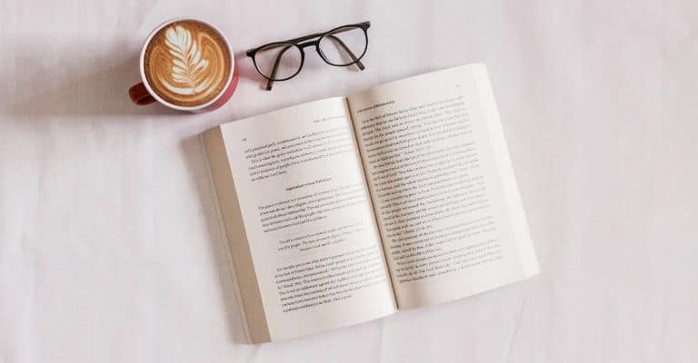 Book, glasses, and coffee.