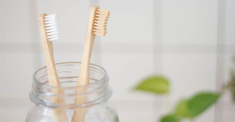 Toothbrushes in a Mason jar.