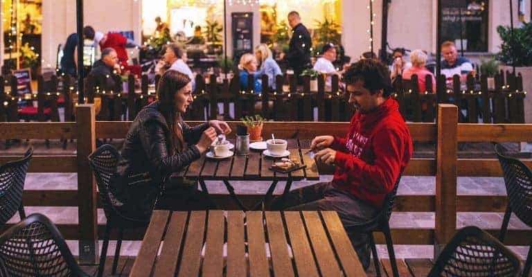 Couple eating outside.