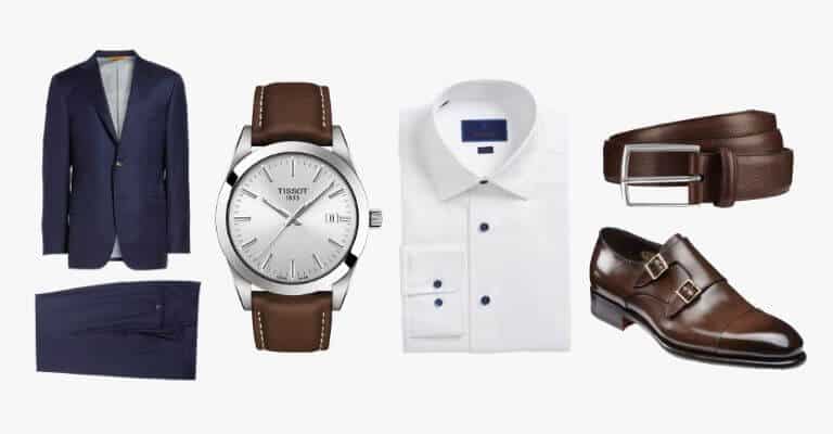 Navy blue suit, white shirt and brown accessories.