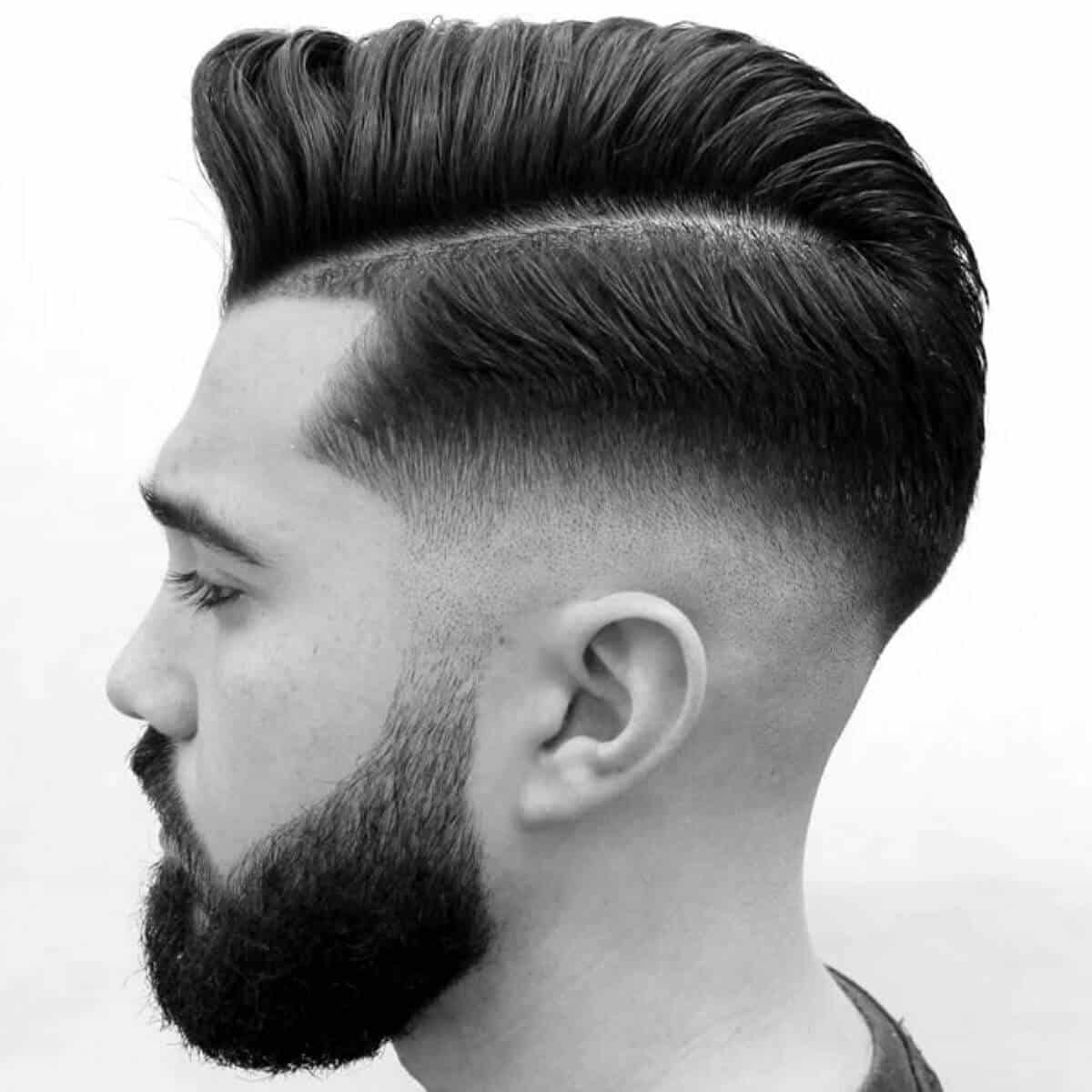 Side profile showing a comb over haircut.