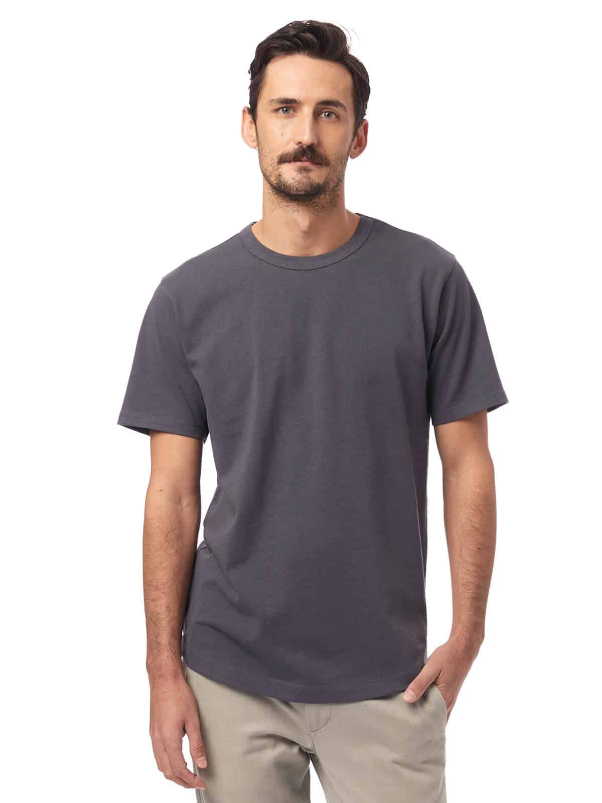 Person wearing a grey t-shirt and beige pants.