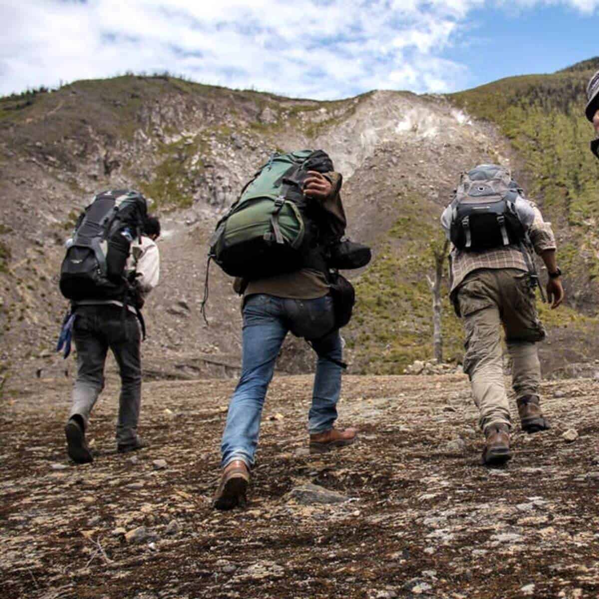 Three people rucking.