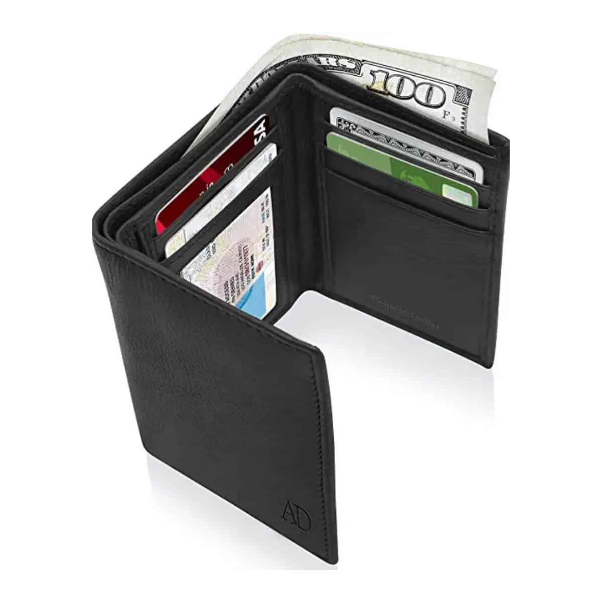 Black leather tri-fold wallet with cards and cash in it.