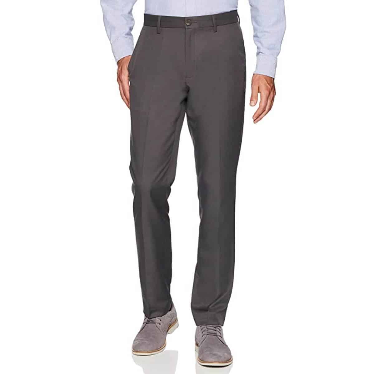 Bottom half of a person wearing dress pants.