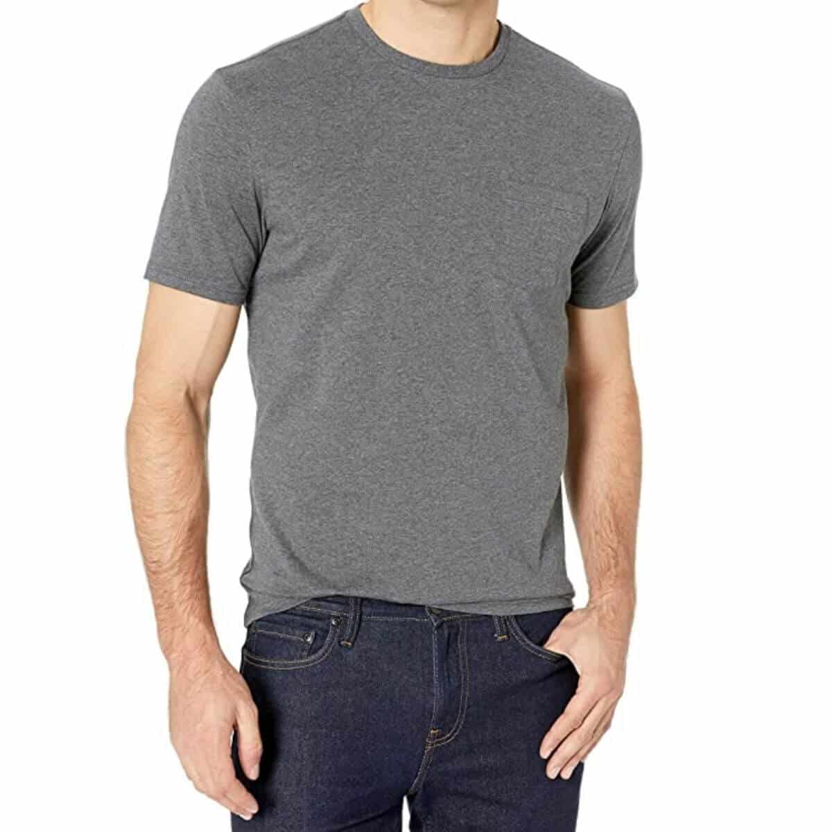 Top half of a person wearing a grey t-shirt and blue jeans.