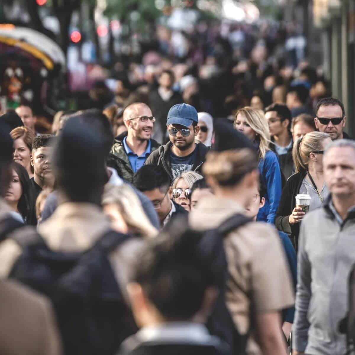 Large crowd walking in the city.