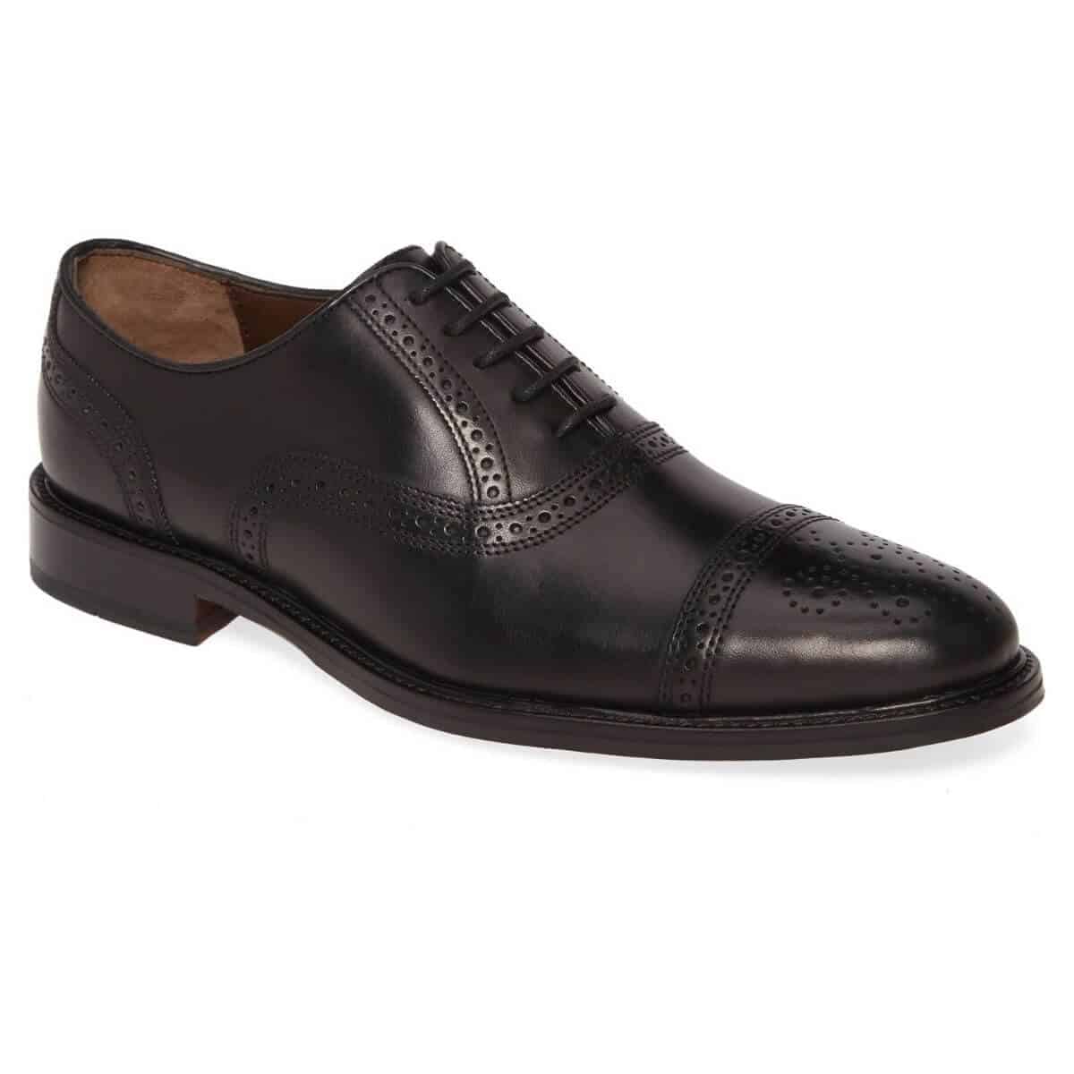 Black leather cap-toe Oxford shoe.