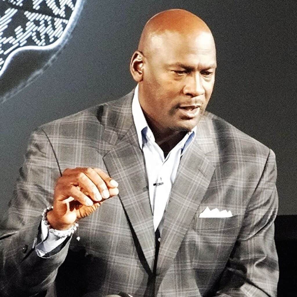 Michael Jordan talking while seated.