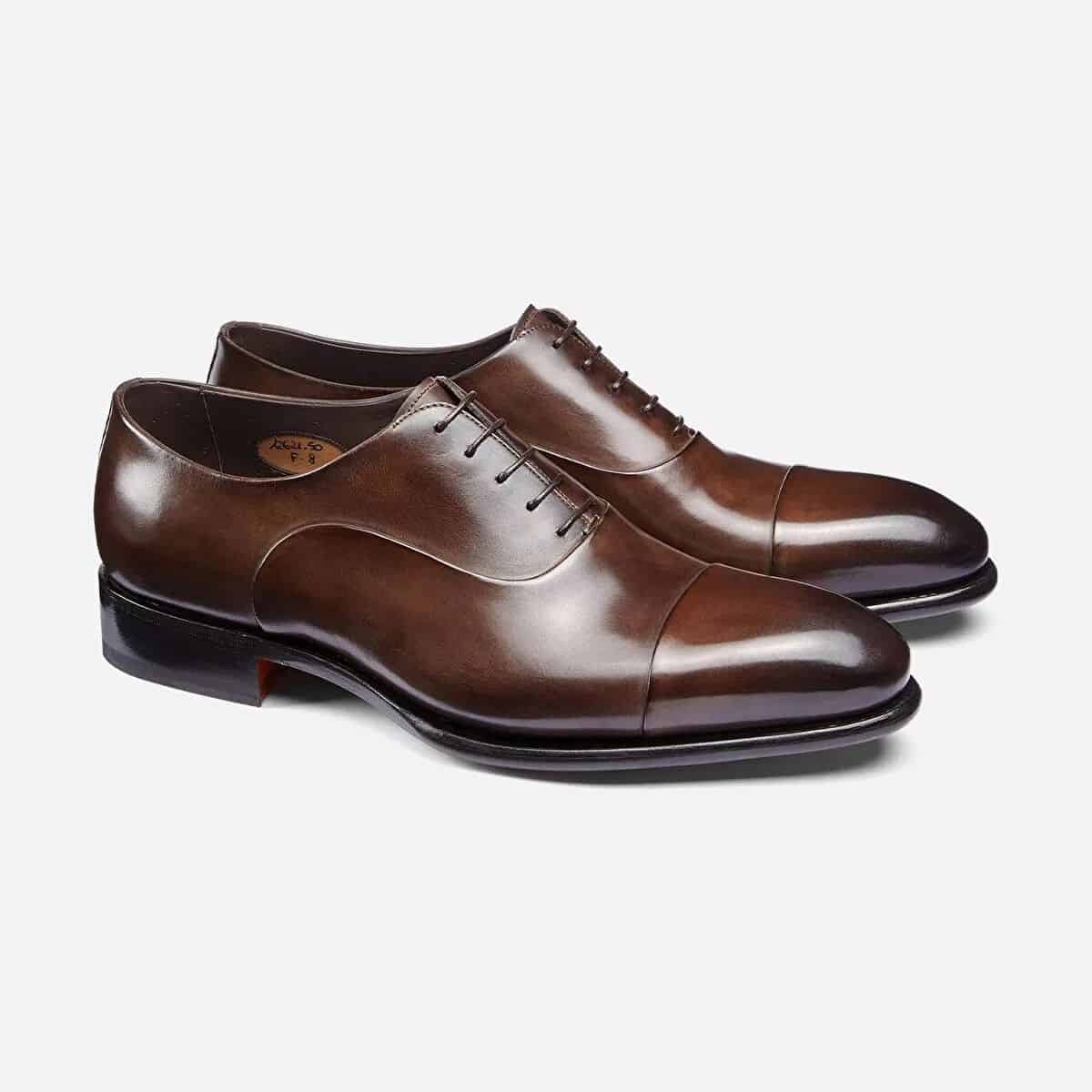 Two dark brown Oxford shoes.