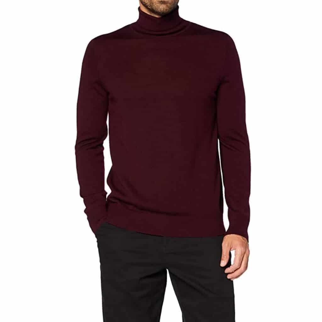 Person wearing a burgundy turtleneck sweater.