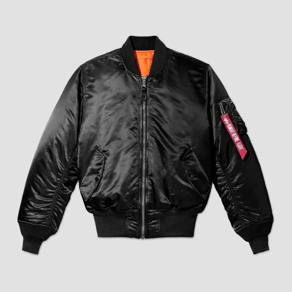 Black Alpha Industries MA-1 bomber jacket with an orange interior lining.