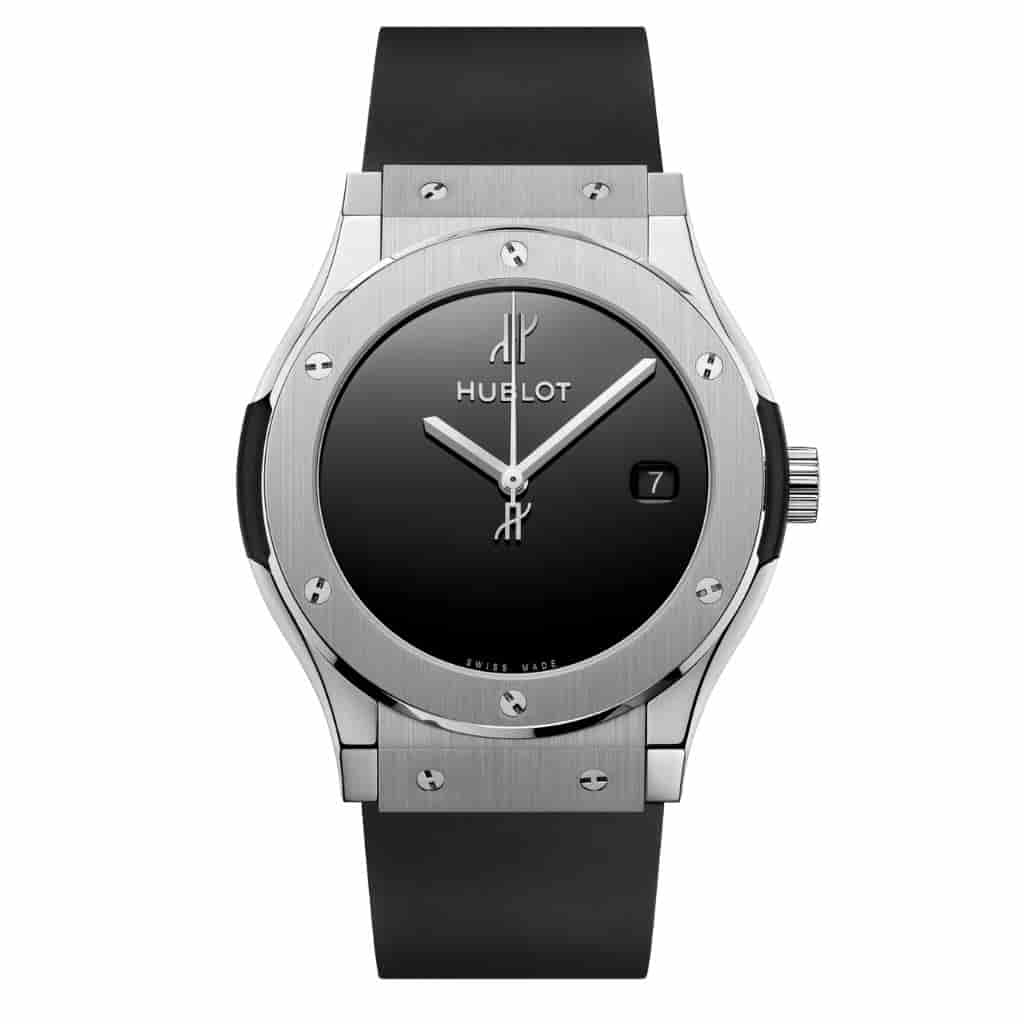 Hublot Classic Fusion watch with a silver metal case and black rubber strap.