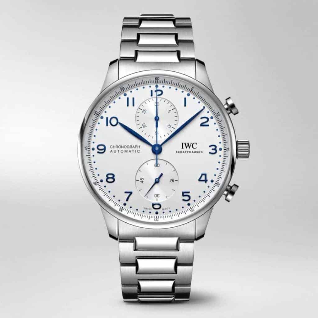 IWC Portugieser watch with blue numbers and silver metal bracelet strap.