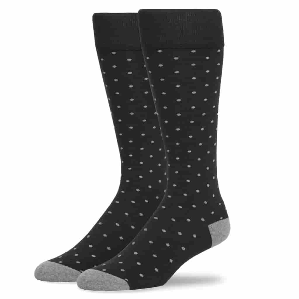 Pair of black socks with grey dots.