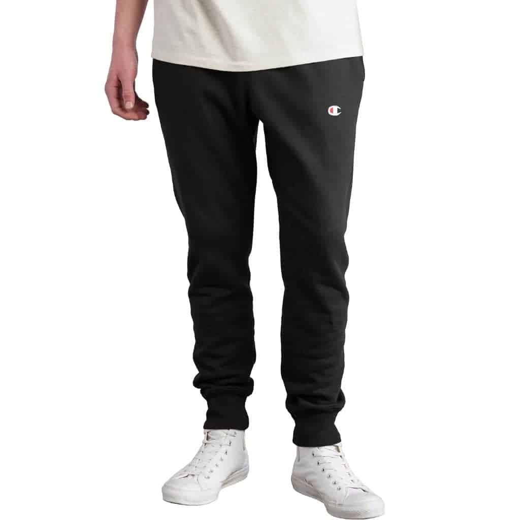 Lower half of a person wearing Champion sweatpants.