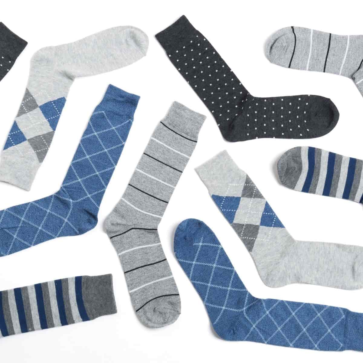 Flatlay of men's dress socks with different patterns.