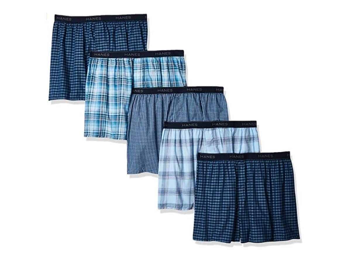 Five Hanes boxer shorts with different patterns and shades of blue.