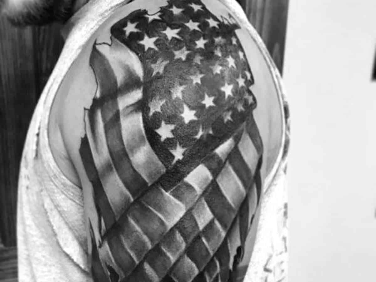 American flag shoulder tattoo.