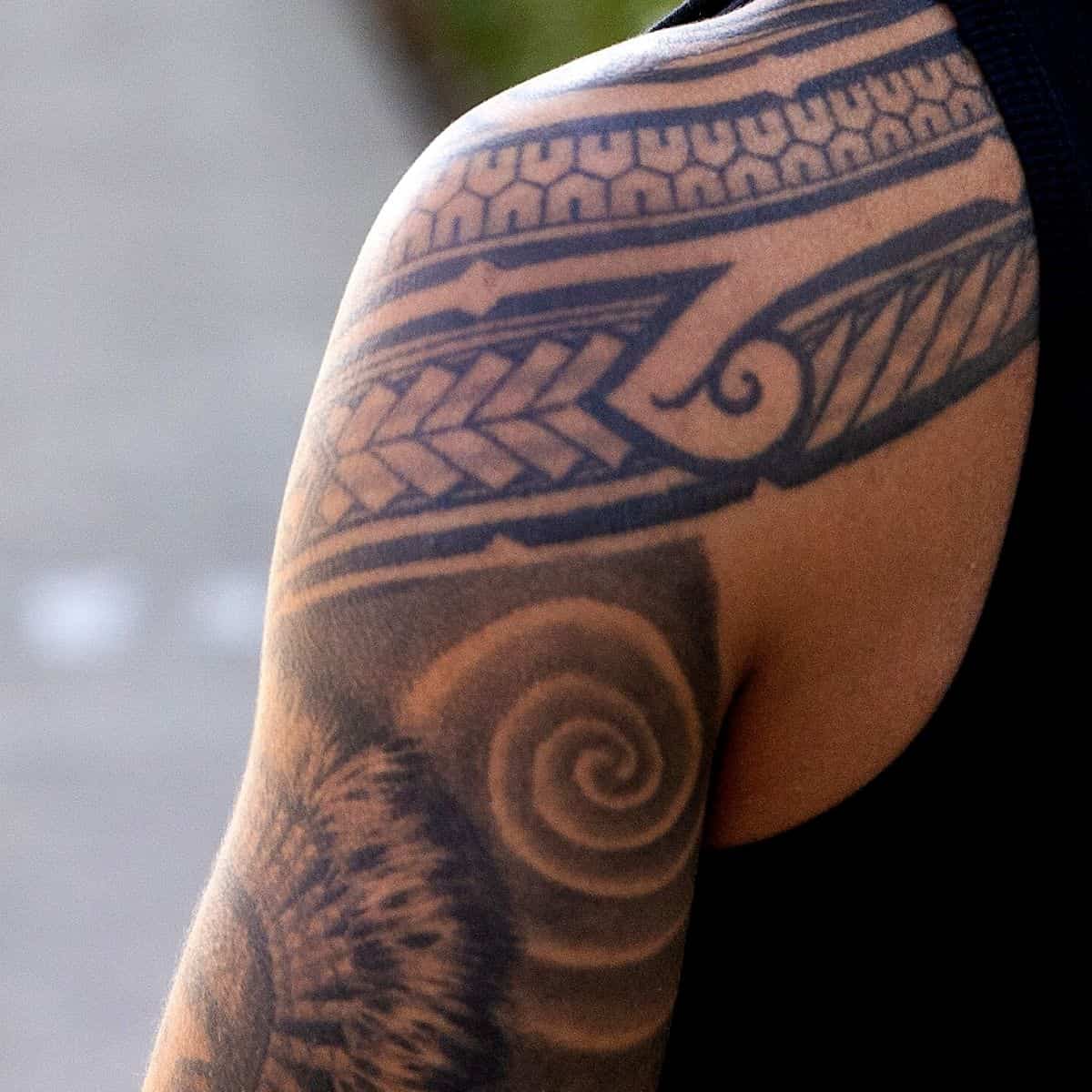 Close-up of a person's shoulder tattoo.