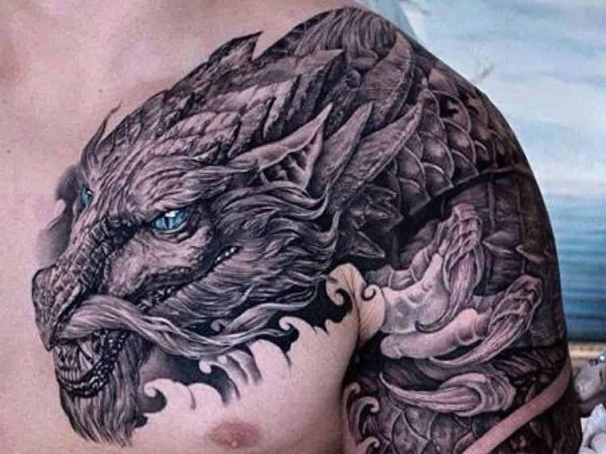 Dragon shoulder and chest tattoo.