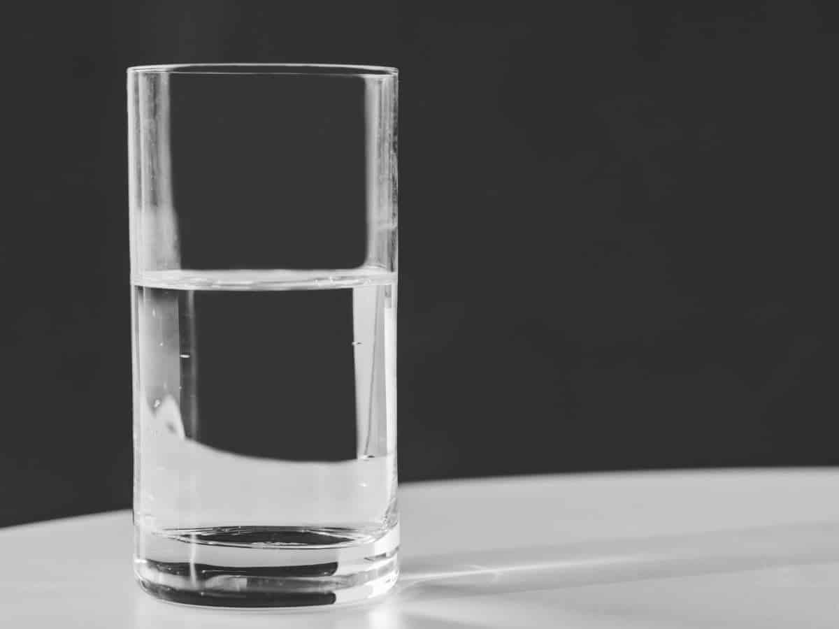 Glass of water on a table.