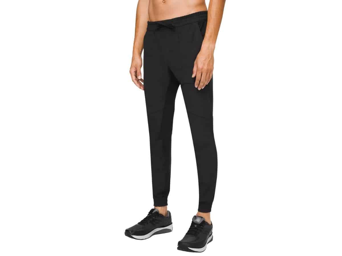 Lower half of a person wearing Lululemon joggers.