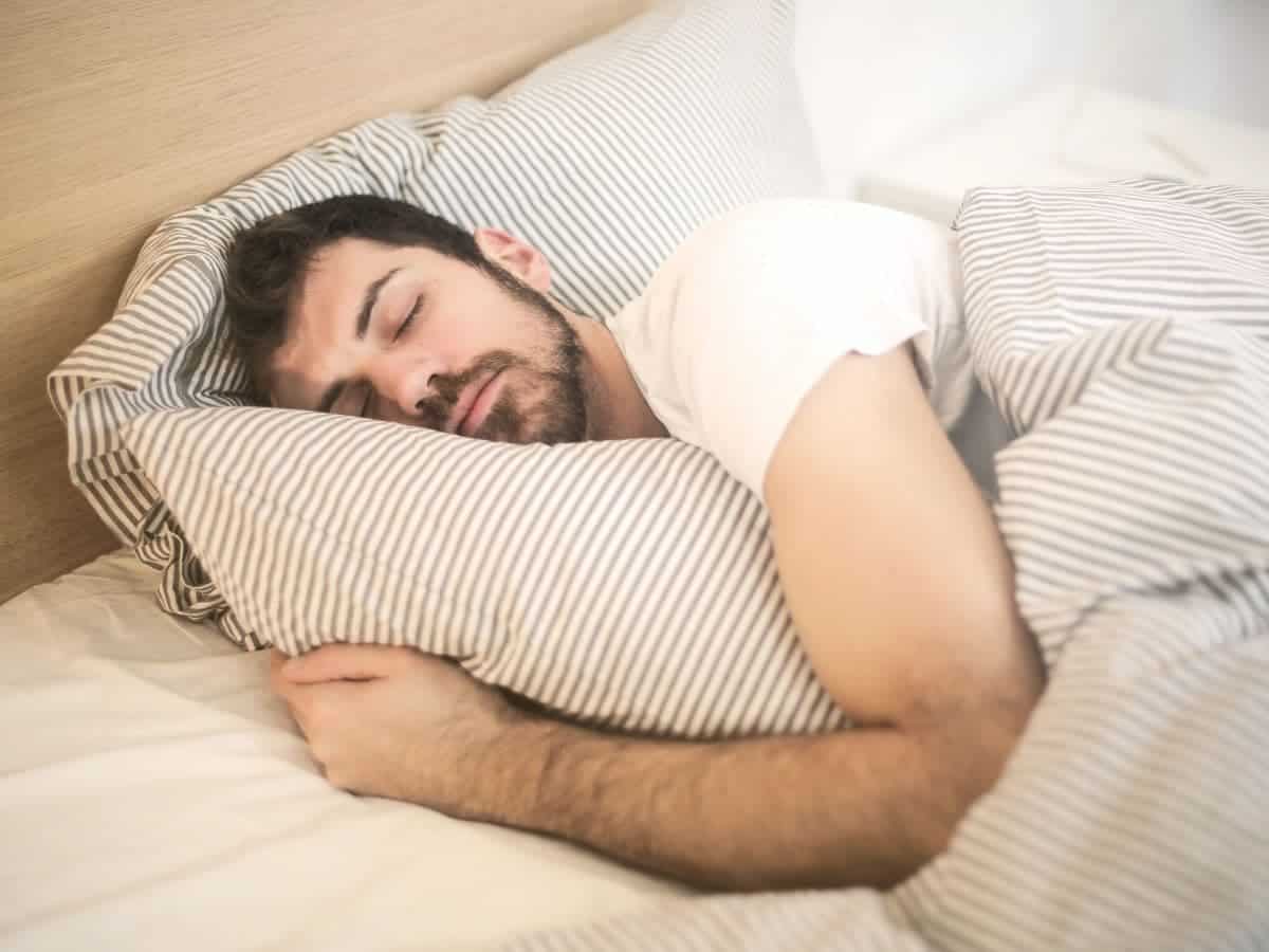 Person sleeping in a bed.