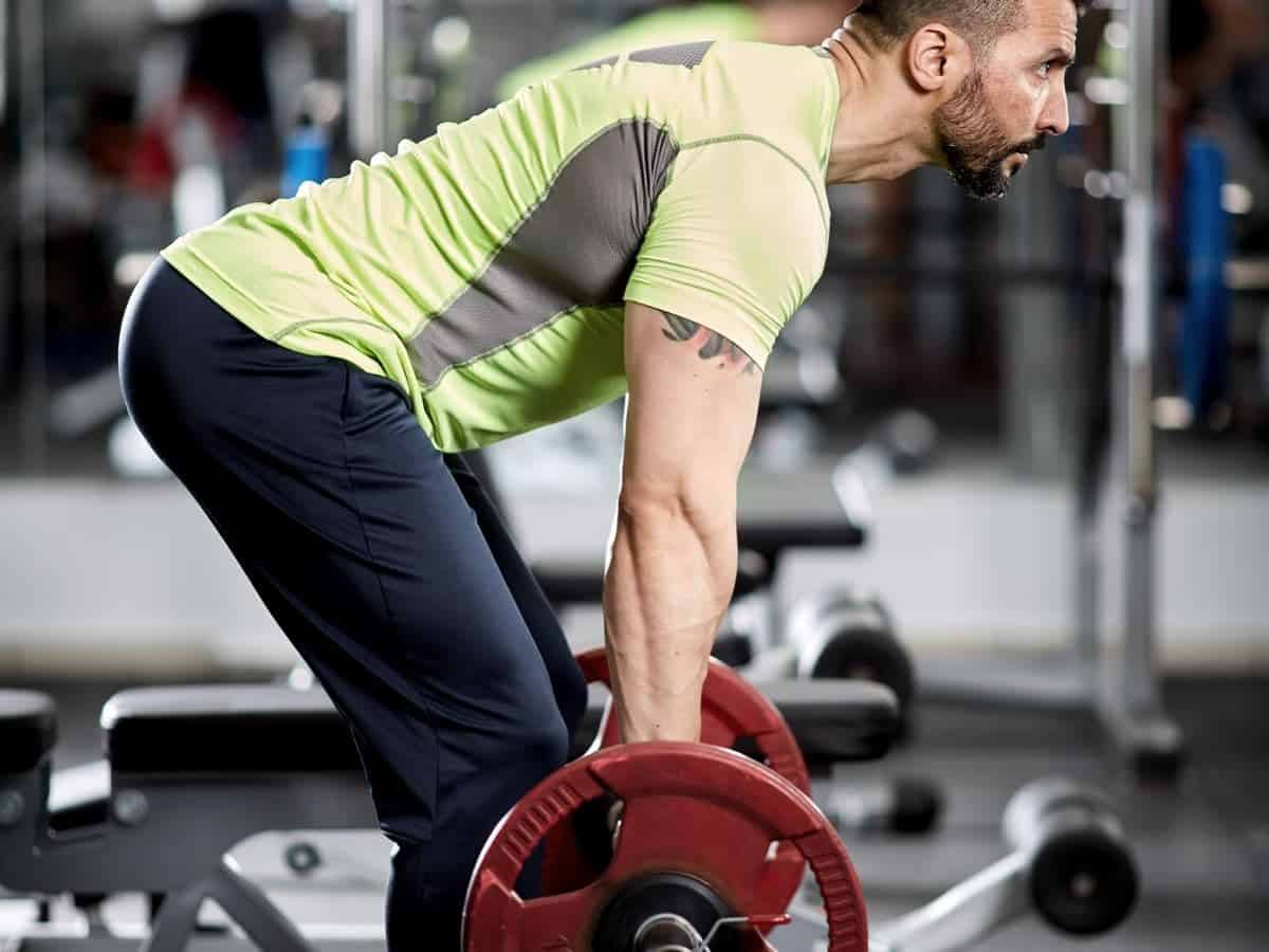 Person doing a barbell bent-over row.