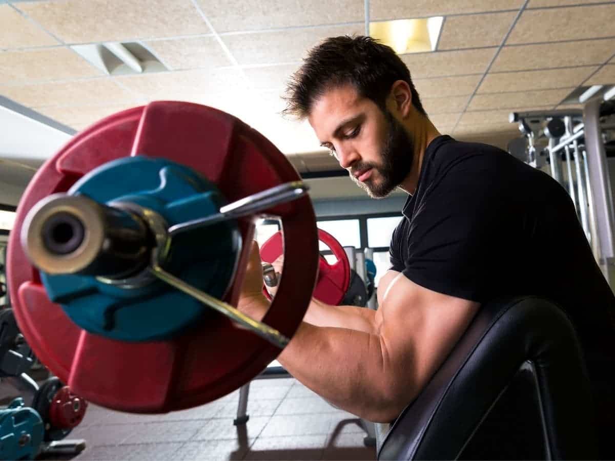 Person doing a preacher curl.