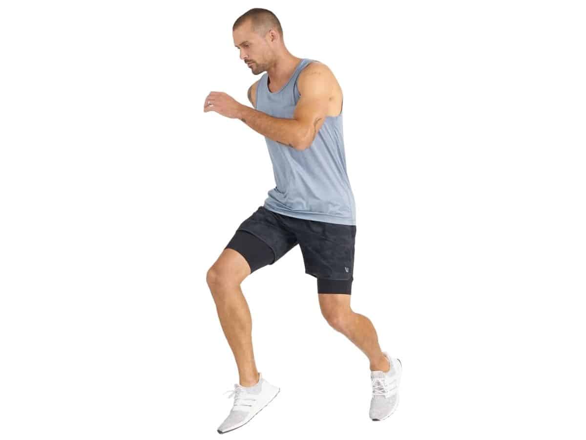 Person jumping and wearing Vuori workout clothes.