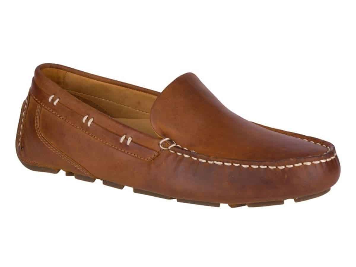 Side of a Sperry brown leather driving shoe.