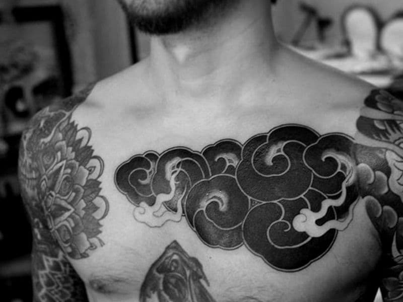 Cloud tattoo on a person's chest.