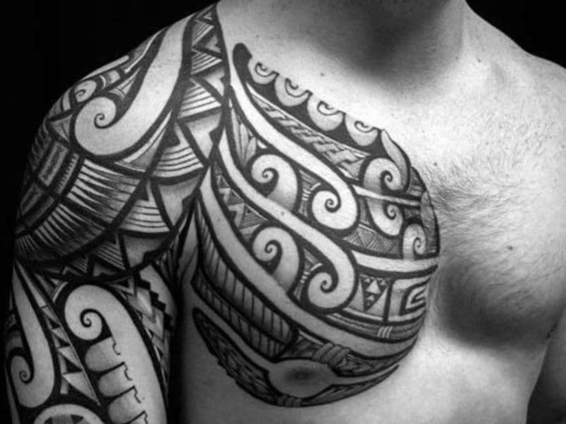 Tribal tattoo on a person's chest and shoulder.