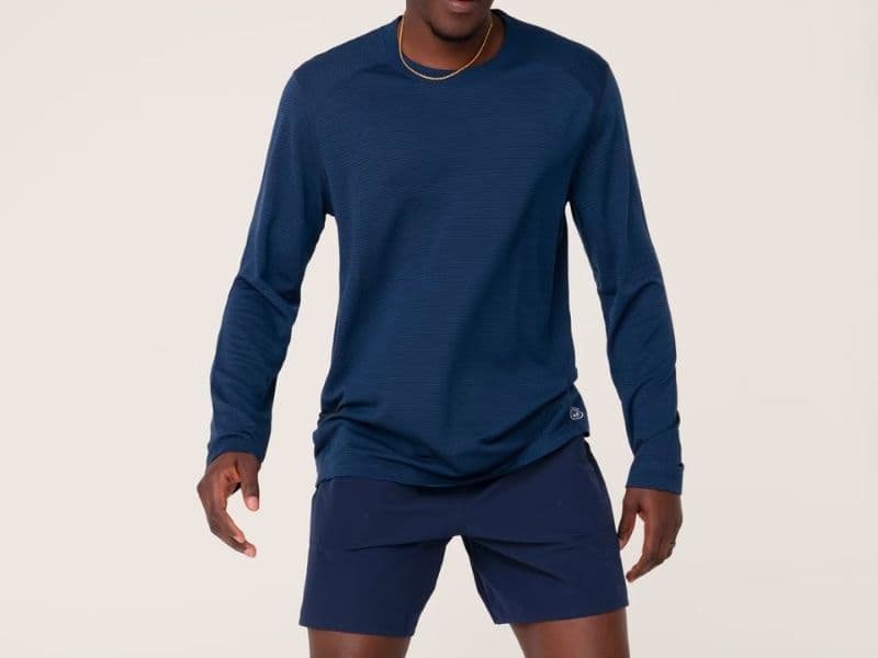 Person wearing Allbirds workout shirt and shorts.
