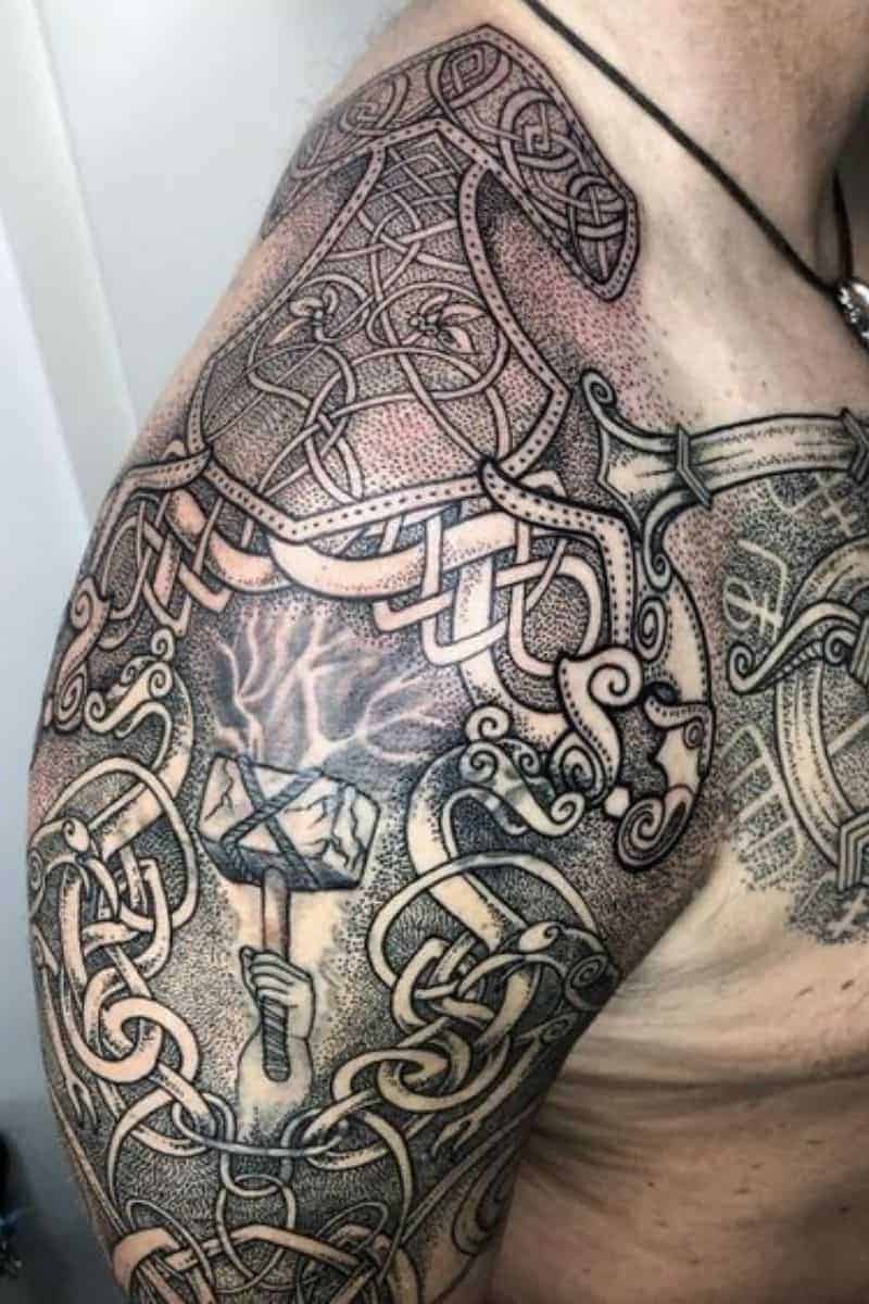 Person with a Norse shoulder tattoo.