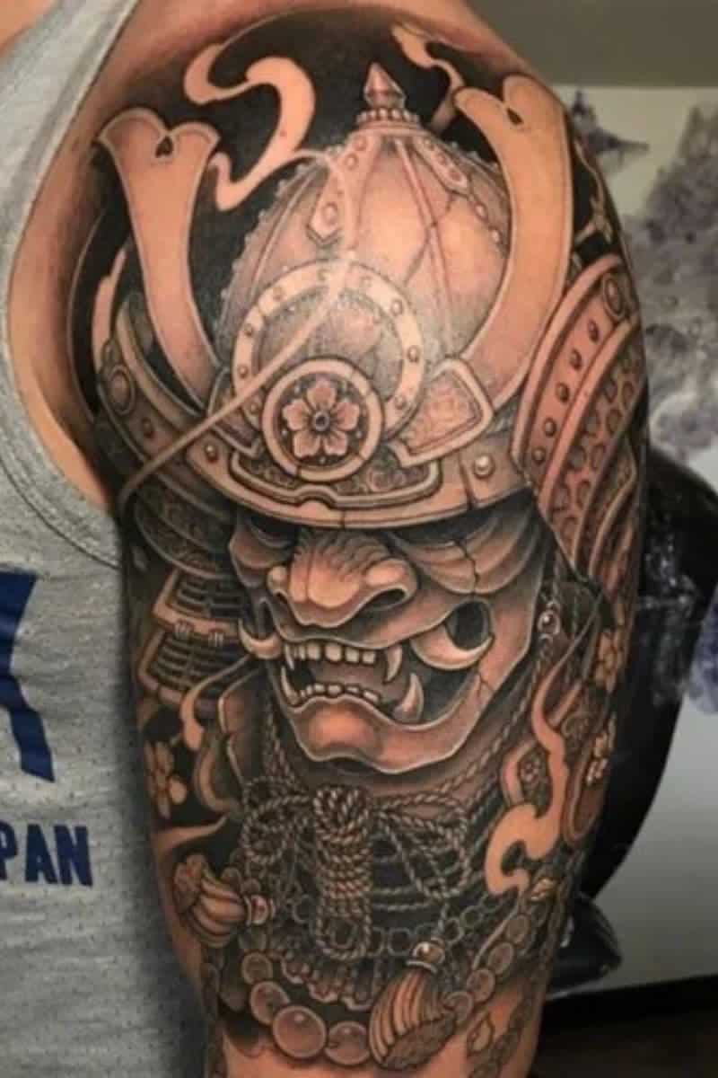 Person with a samurai shoulder tattoo.