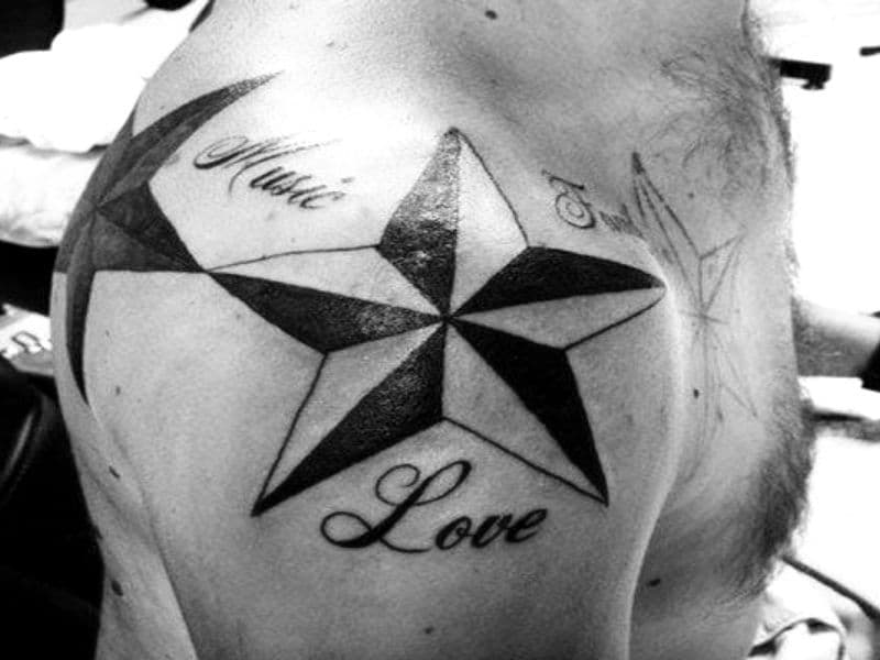 Person with a shoulder tattoo of stars.