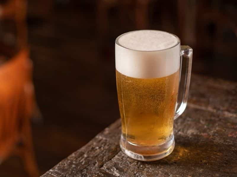 Mug of beer on a table.