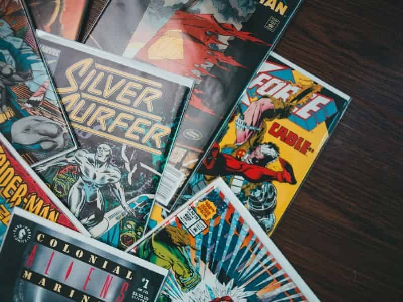 Comic books on a table.