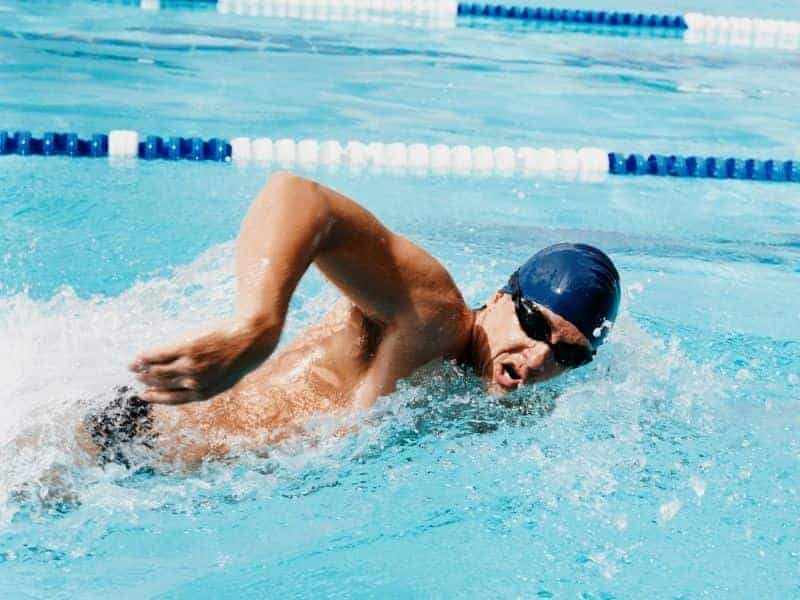 Person swimming in a pool.