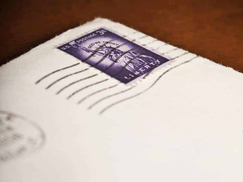 Stamp on an envelope on a table.