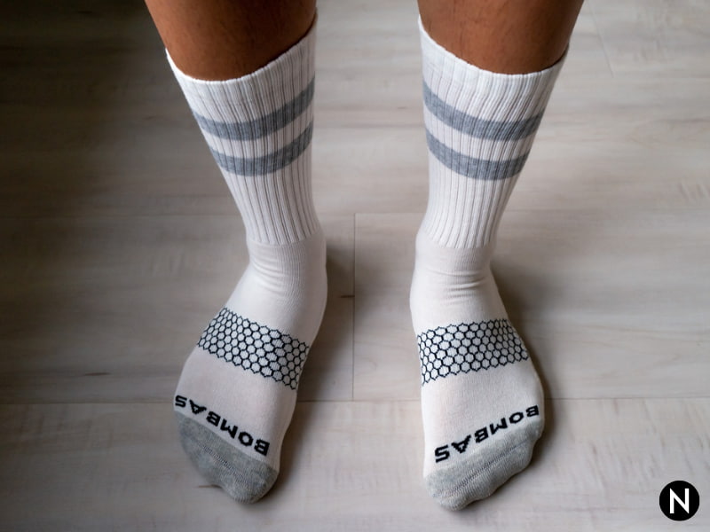 Person wearing Bombas Vintage Stripe Calf socks.